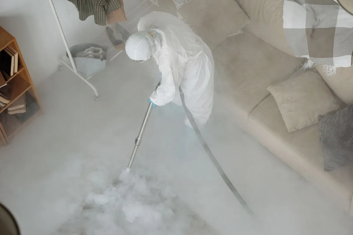 Biohazard cleanup technician in protective equipment, Spring House, PA